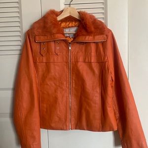 Beautifully bright vintage genuine leather orange bomber coat.  Great condition!